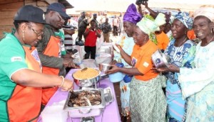 FOOD KITCHEN 2L-R: Wife of Ekiti State Governor, Erelu Bisi Fayemi; her husband, Governor Kayode Fayemi; with some aides, serving some elderly citizens in the ?Soup Kitchen? initiative of the Ekiti Development Foundation (EDF) in Itapa Ekiti... on Friday.