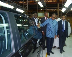L-R: Minister of Industry, Trade and Investment, Mr. Olusegun Aganga; and Managing Director, Peugeot Automobile Nigeria, Alhaji Ibrahim Boyi; during the inspection of newly assembled cars at the PAN factory in Kaduna 