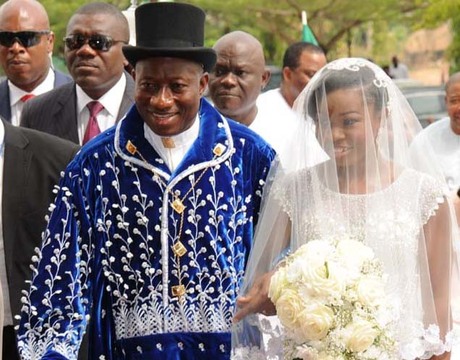 PRESIDENT GOODLUCK JONATHAN WALKING INTO THE CHURCH WITH HIS DAUGHTER, FAITH, DURING THE WEDDING HIS DAUGHTER TO GODSWILL IN ABUJA ON SATURDAY (12/4/14).