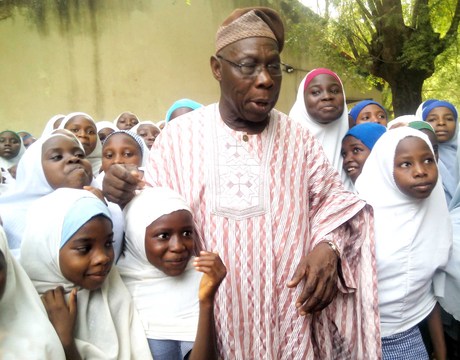 FORMER PRESIDENT OLUSEGUN OBASANJO WITH PUPILS AND STUDENTS OF HIS ADOPTED SCHOOL,  GOVERNMENT GIRLS SECONDARY SCHOOL, KUDAI IN JIGAWA ON MONDAY (12/5/14). 