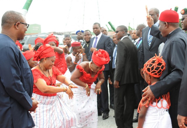 PRESIDENT GOODLUCK JONATHAN (R), ACKNOWLEDGING TRADITIONAL DANCERS HERALDING HIS ARRIVAL FOR THE GROUND BREAKING CEREMONY FOR  SECOND NIGER BRIDGE IN ONITSHA.