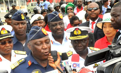 CHIBOK—The Chief of Defence Staff, Air Chief Marshal Alex Badeh (L), speaking during a protest over abducted Chibok school girls in Abuja, yesterday.
