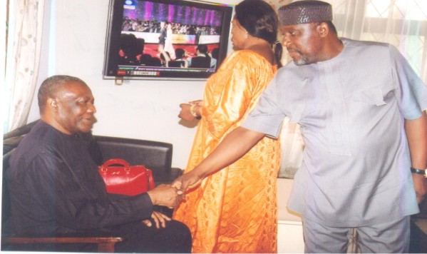 ROCHAS OKOROCHA IN HANDSHAKE WITH ARTHUR NZERIBE (L) SEATED