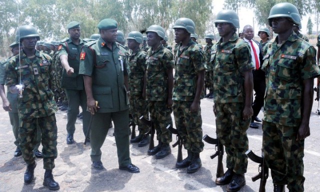 CHIEF OF ARMY STAFF, LT.- GEN.  KENNETH MINIMAH, INSPECTING A PARADE, DURING A PARADE  IN HIS HONOUR,  AT INFANTRY CORPS IN JAJI, KADUNA, ON FRIDAY (21/3/14).