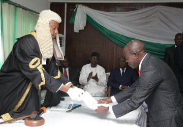 GOV. ADAMS OSHIOMHOLE PRESENTING THE BUDGET ESTIMATES FOR 2015 FISCAL YEAR TO THE SPEAKER, UYI IGBE LAST WEEK