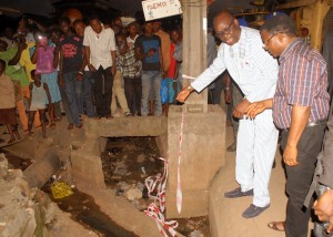 Ekiti State Governor, Mr Peter Ayodele Fayose ( left) and the Director of Civil Engineer, Ministry of Works, Engr Julius Olofin during the governor's inspection of the ongoing construction of bridges and drainages at Idemo Street in Ado Ekiti last Friday.