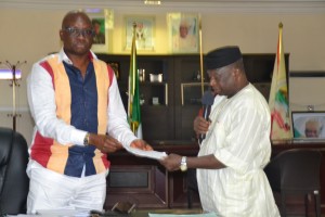 Ekiti State Governor, Dr. Ayodele Fayose (left) receiving the draft constitution amendment from the Speaker of Ekiti State House of Assembly, Rt. Hon. Albert Adewale Omirin in the Governor’s Office 