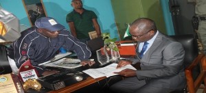 Ekiti State Deputy Governor, Dr. Kolapo Olusola (right) going through some records in the Principal’s office, while the Principal of the of Annunciation School, Ikere, Mr. Niyi Oladimeji gives further explanation during the deputy governor’s visit to the school 