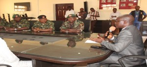 Ekiti State D. Gov., Dr. Kolapo Olusola (right)addressing Major Gen. Sannusi Nasir Muazu, GOC 2 Division, Nigeria Army and others with him during the GOC’s visit to the state.