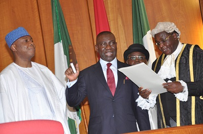 CLERK TO THE NATIONAL ASSEMBLY, SALISU MAIKASUWA (R) SWEARINNG-IN THE DEPUTY SENATE PRESIDENT, IKE EKWEREMADU AT THE INAUGURATION OF THE 8TH NATIONAL ASSEMBLY IN ABUJA ON TUESDAY (9/6/15).WITH THEM  IS SENATE PRESIDENT BUKOLA SARAKI. (NAN)