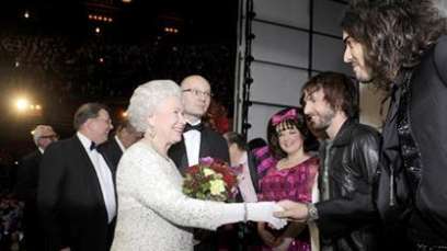 Russell Brand bows, greets The Queen