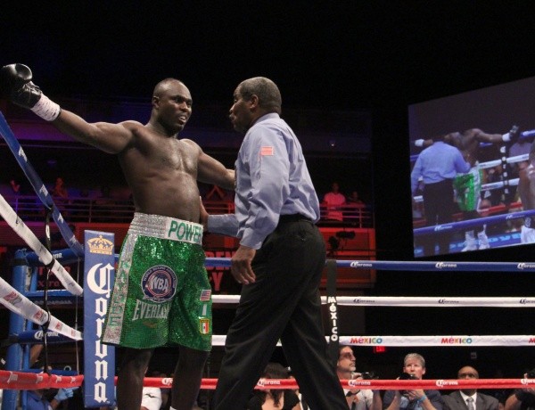 Kayode Gesturing to the Referee He Wasn't Hurt During His WBA Heavyweight Title Fight With Luis Ortiz. Image. WBA/Sumio Yemada.