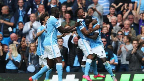 Raheem Sterling Celebrates With Bacary Sagna after Scoring His First League Goal for City. Image: Getty.
