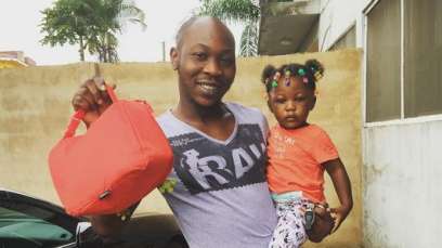 #Celebrity > Afrobeat legacy, Seun Kuti Share Photos Of His Daughter’s First Day At School 4 Seun Kuti taking his daughter to school