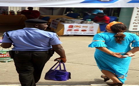 policeman-carrying-bag