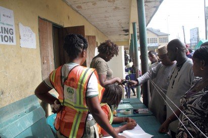 A Voter being Accredited by an INEC Official at unit 18 Ward 6 Amarata, Yenegoa during the Bayelsa State Governorship Election. Photo: Nwankpa Chijioke