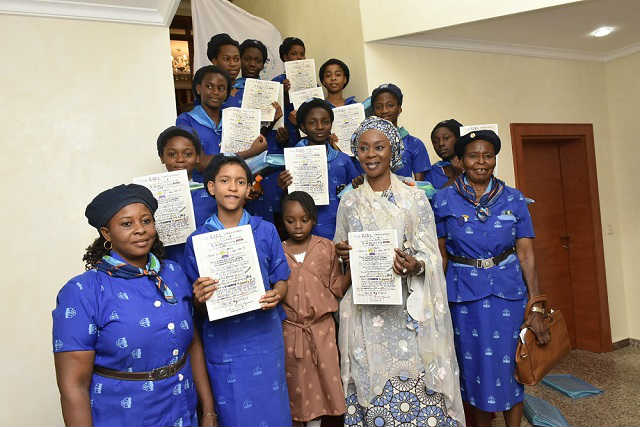 Her Excellency Mrs Toyin Saraki with Members of the Holy Rosary Girls College Girl Guides Area Council Gwagwalada Holding the Girl Declaration