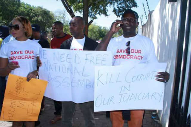 Group Protest In South Africa For Independent NASS and Corrupt Free Judiciary In Nigeria 6 Nigerians protest at the outside of the Nigerian Embassy in South Africa