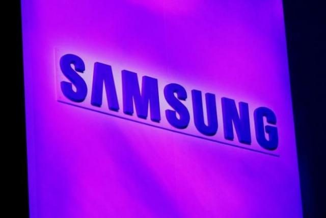 The company logo is displayed at the Samsung news conference at the Consumer Electronics Show (CES) in Las Vegas January 7, 2013. REUTERS/Rick Wilking/File Photo - RTSGH9W