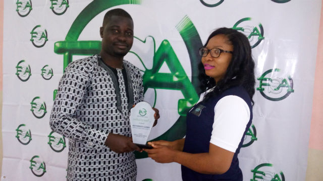 Receiving the Award, the media officer of the Foundation, Mr. Oyejide Sunkanmi