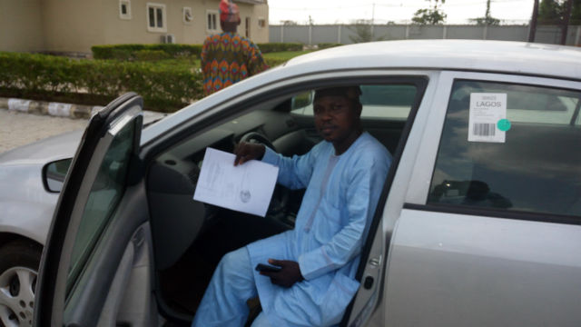 Mr. Yomi Sholanke showcasing his new car. 