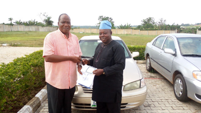 Otunba (Comrade) Niyi Osoba presenting a car to Mr. Olusola Salau
