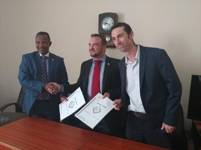 Bujumbura Mayor and Gigawatt Global leaders Michael Fichtenberg and Nathaniel Johnson sign the solar Light Islands deal