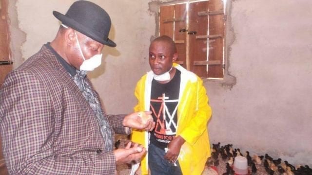 Brigadier General Paul Boroh (Rtd) looking at a chick