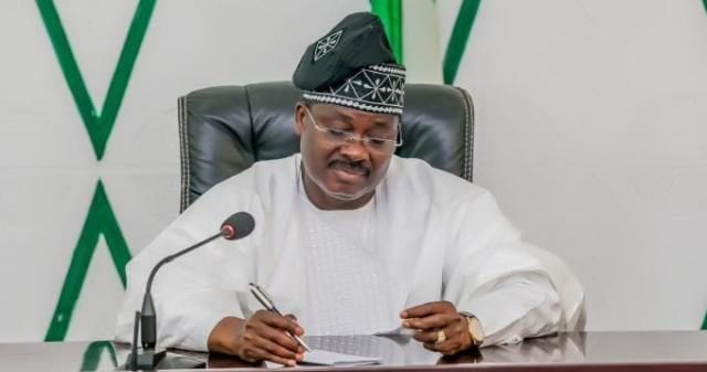 Oyo State Governor, Senator Abiola Ajimobi signing an official document