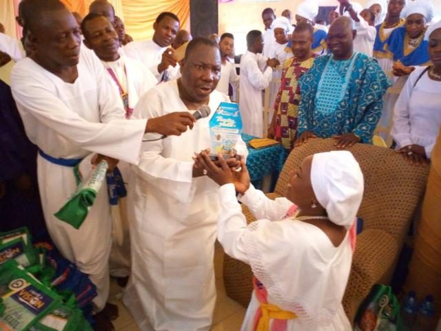 Humility...Mother Celestial Nike Adebutu kneels to receive her plaque from Prophet Alomanoaboe