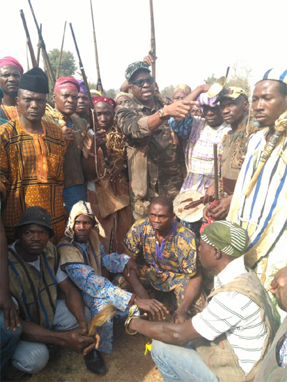 Ekiti Stat Governor Ayodele Fayose with some Hunters in the state