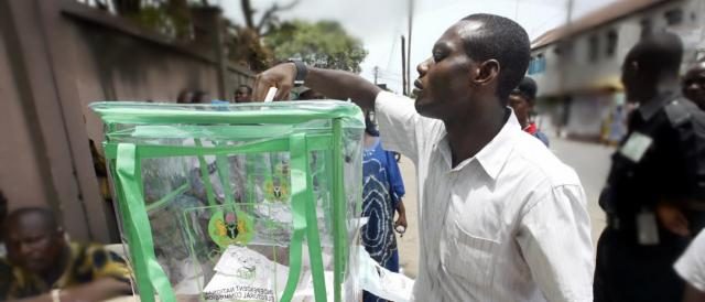 A Nigerian Voter casting his vote during an election