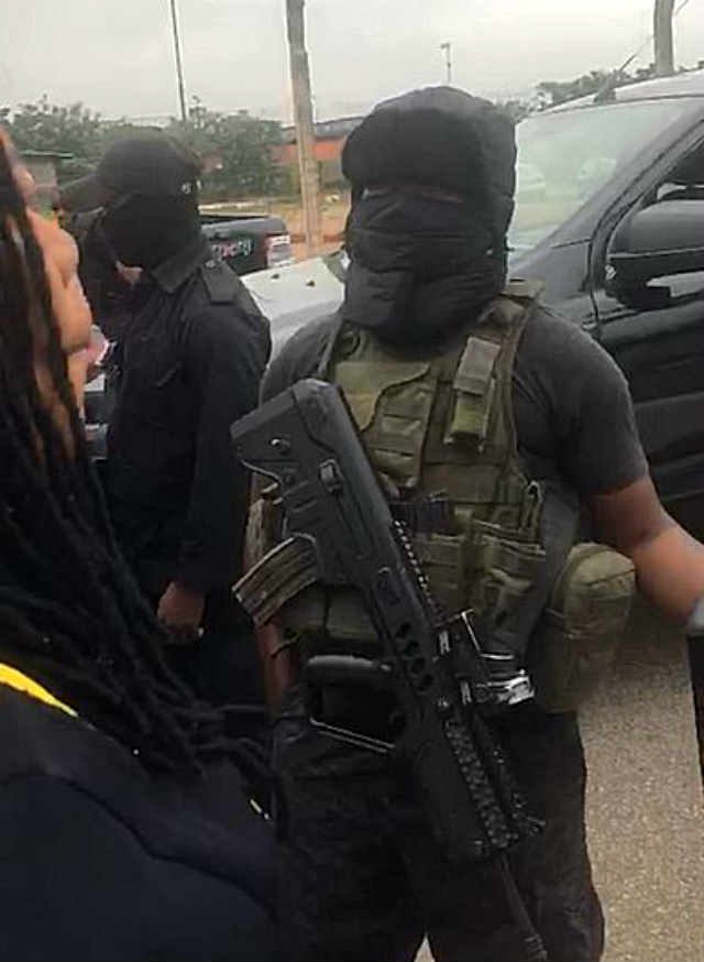 Masked security personnel at the NASS Complex, Abuja