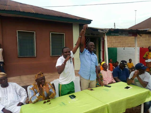 Ikenne LG PDP Secretary, Omooba Dayo Sonuga raises the hand of Omooba Solarin as the party's candidate for Ogun State House of Asembly Ikenne State Constituency for 2019