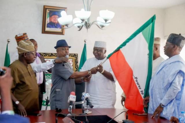 PDP National Chairman, Prince Uche Secondus handing over Ogun Governorship Flag to Hon Ladi Adebutu