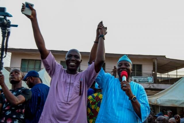 Hon Sikirulai raises Omooba Sunday Solarin's hand as the 2019 PDP candidate for Ogun State House of Assembly, Ikenne State Constituency