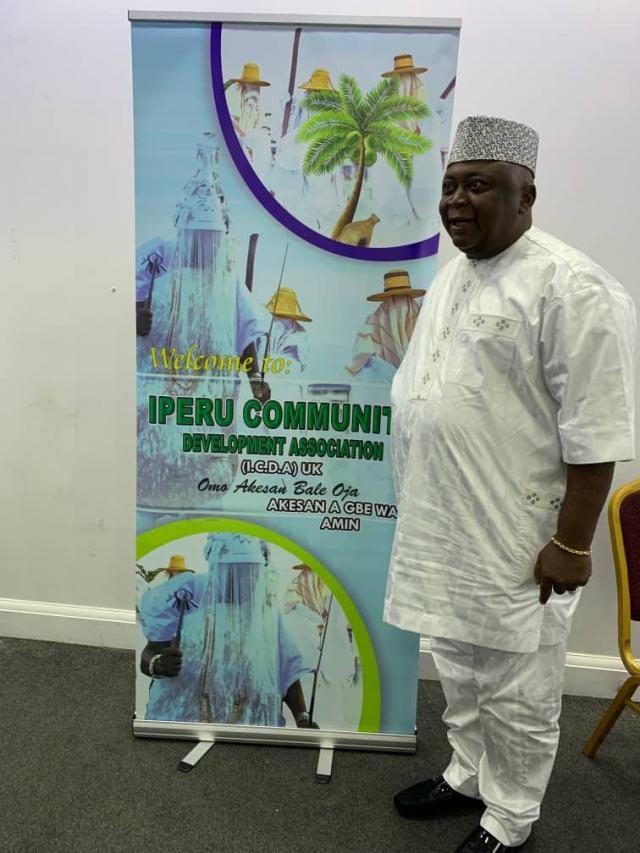 Hon Oladipupo Adebutu beside Iperu Community Development Association Stand at the 4th Annual Remo Day in the UK