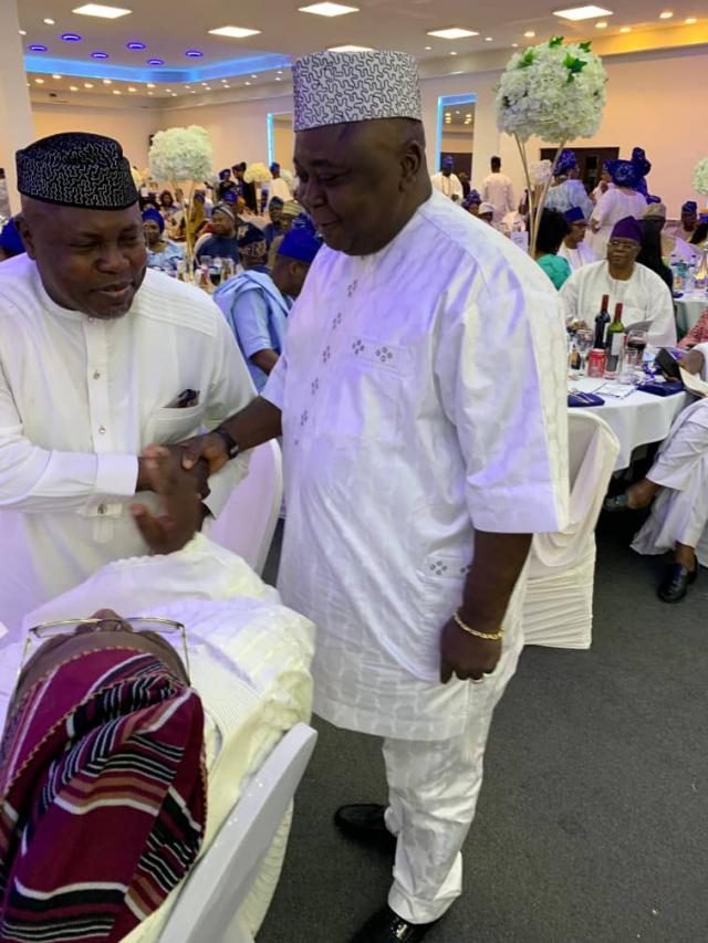 Hon Oladipupo Adebutu cheering with a guest at the 4th Annual Remo Day in the UK