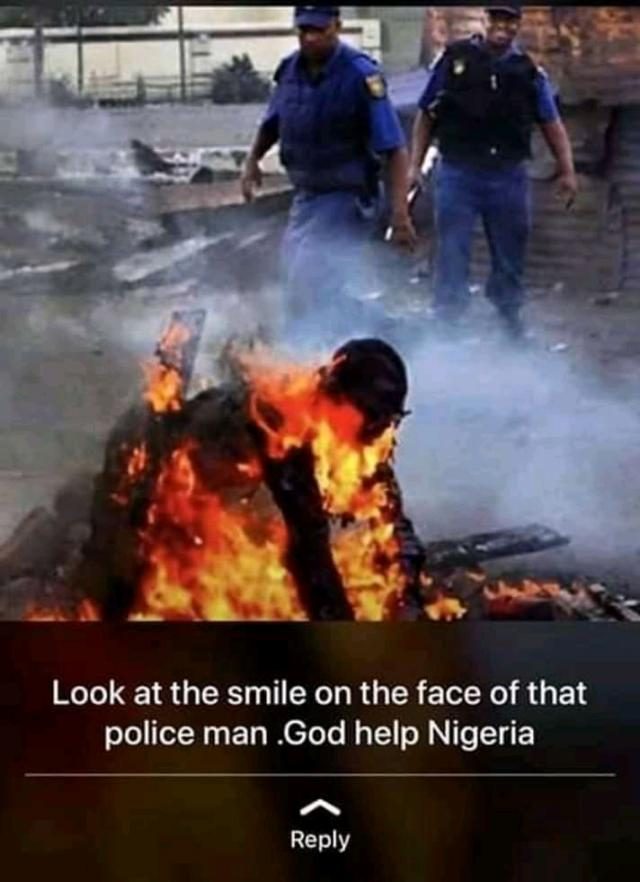 Xenophobic Attacks, totally strange and against Mandela's Philosophy - Omooba Solarin 3 Xenophobic Attacks in South Africa - Smile on the face of a Police