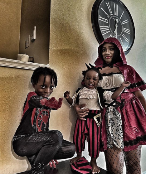 Olamide's partner, Adebukunmi and their kids