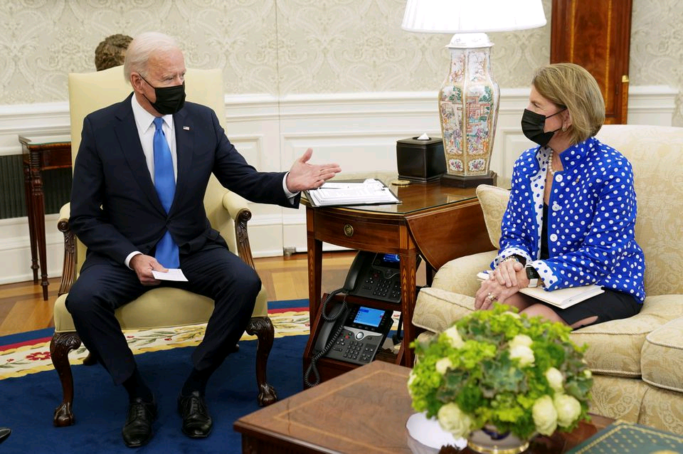 U.S. President Joe Biden gestures toward Senator Shelley Capito