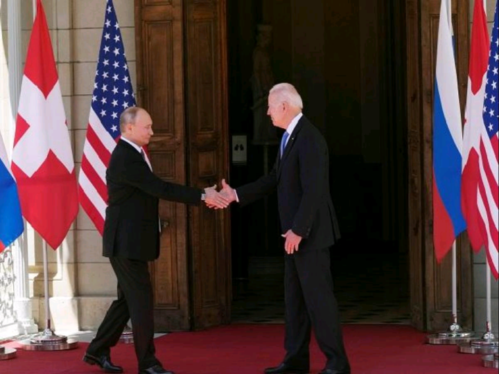 Russian President Vladimir Putin and US President Joe Biden shake hands during their meeting at Villa la Grange in Geneva, Switzerland