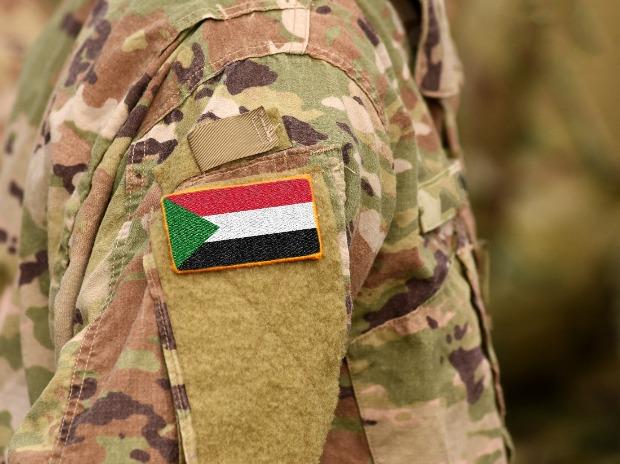 Sudan flag on soldiers arm