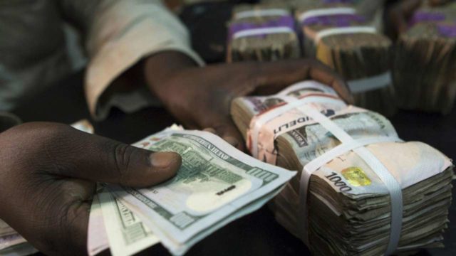 Naira Goes Down To Record Low Amid New Year Uncertainties 1 naira and dollars