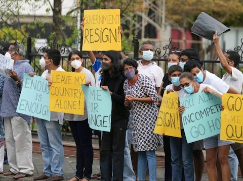 Sri Lankans participate in a protest