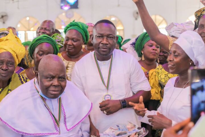 Superior Evangelist Ewubajo joins Oluwole in celebrating God.