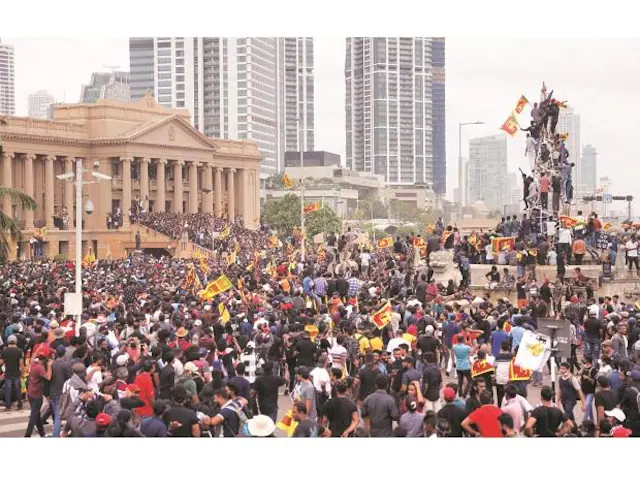 Demonstrators celebrate after entering the Presidential Secretariat during a protest, after President Gotabaya Rajapaksa fled amid the country’s economic crisis, in Colombo.