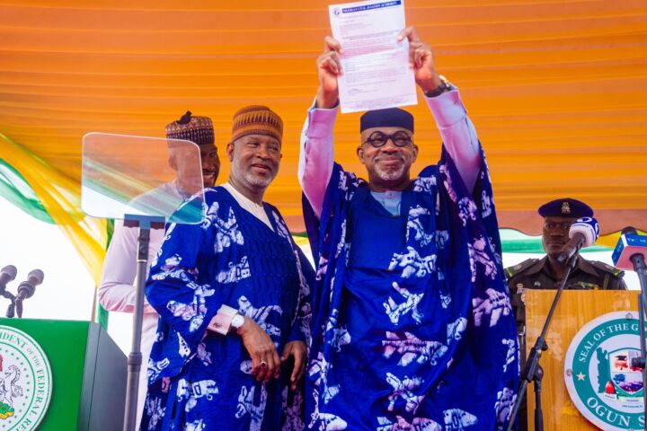 Governor Dapo Abiodun displaying the approval certificate handed by Aviation Minister Hadi Sirika at the Maiden flight event of Ogun Gateway International Agro Cargo Airport