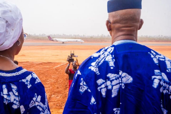 Governor Dapo Abiodun with wife look on while ValueJet flight landed at the Maiden flight event of Ogun Gateway International Agro Cargo Airport