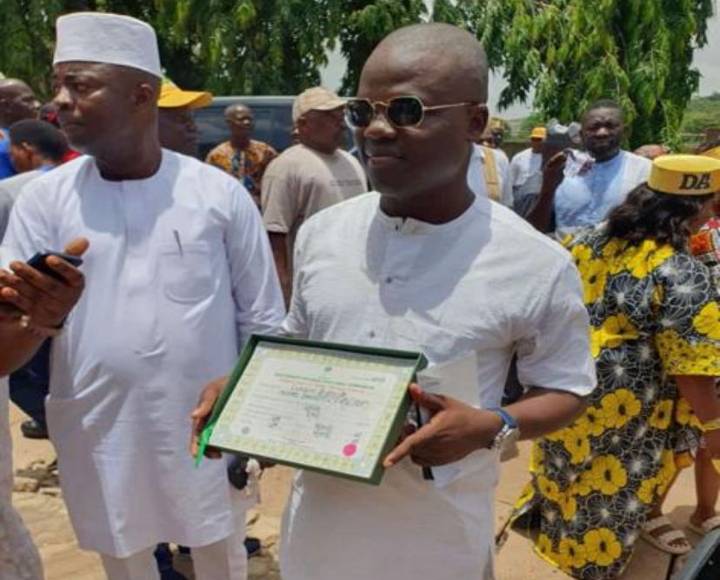 Jide Owodunni parading the INEC Certificate of Return in presence of his APC supporters at Abeokuta, Ogun State